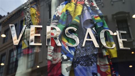 how has michael kors acquisition of versace|who owns Versace company now.